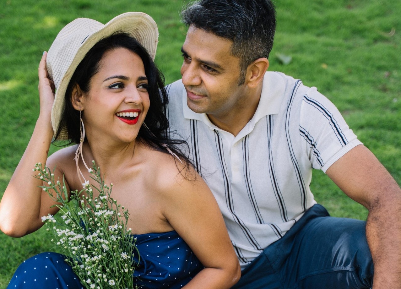 Young Indian couple dressed in American attire in a happy marriage.