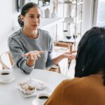 Black couple having a conflict at a table not being patient